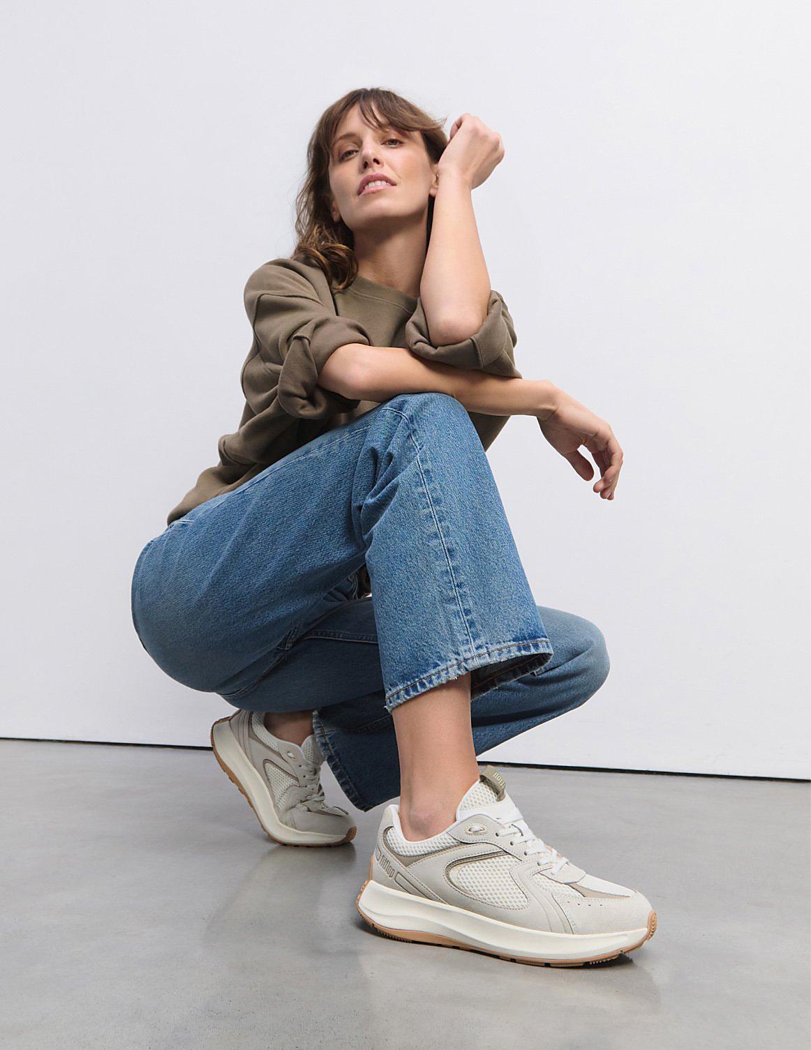 woman wearing f mode flow trainers - from fitflop uk